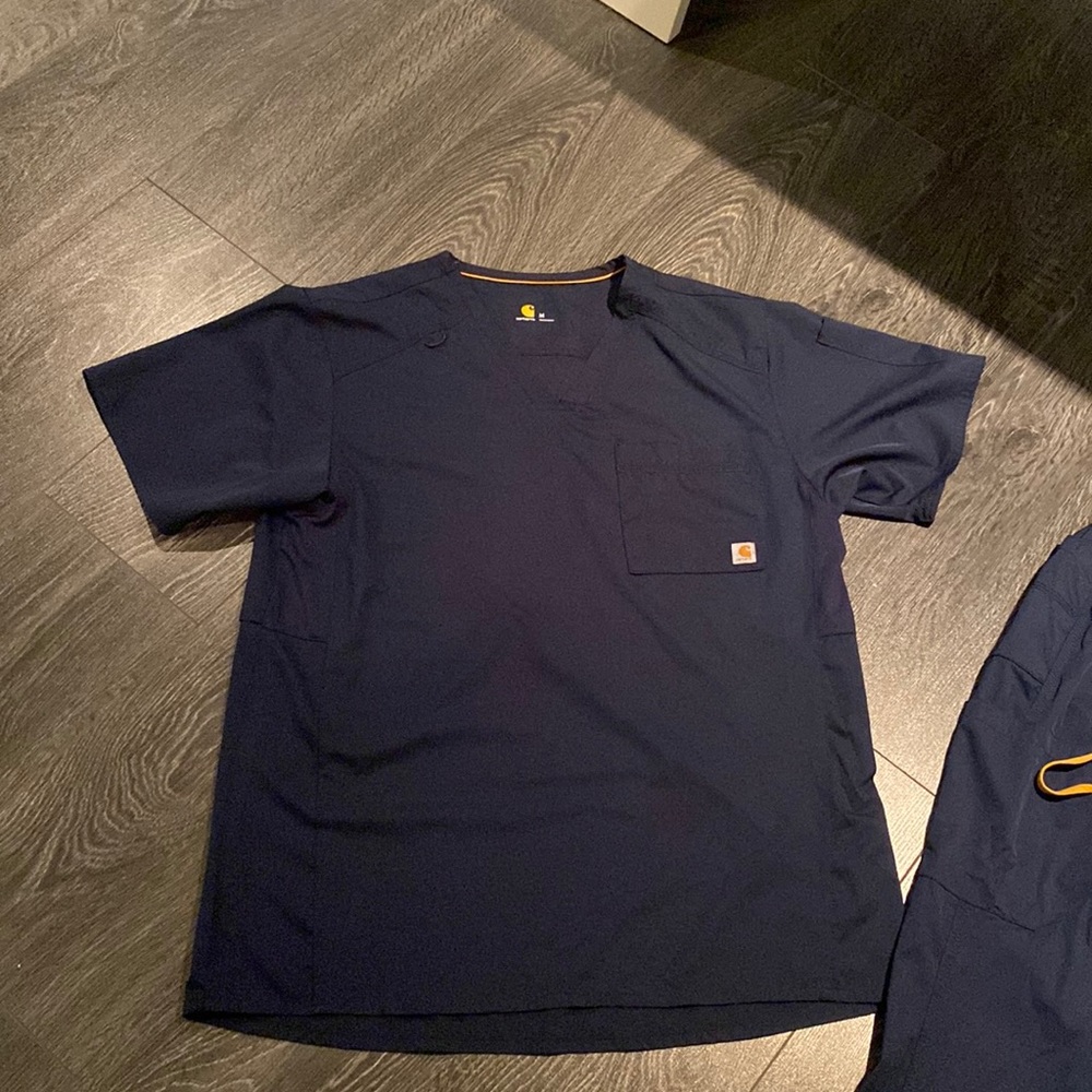 CARHARTT navy scrub top. New without tags